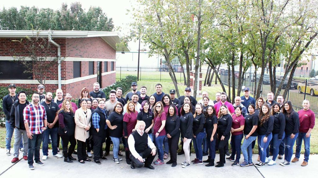 Image of company employees outside an office.